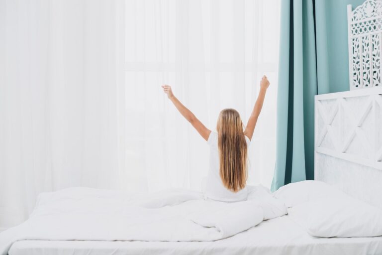 Back view girl stretching after waking up 23 2148277162